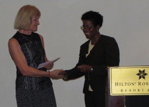 Transition Coordinator Angela Dekker (left) receives, on behalf of RCN / OCW, the official confirmation of membership from the hands of Estellita Rene of CANTA. 