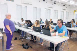 Sharon Kjellquist of TDC in St. Maarten (left) teaching the Microsoft Office Excel Level course.