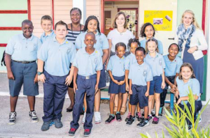 Sacred Heart School Principal Diane Wilson (left), new teachers Femke Neunzig (centre) and Selma Neel (right) with a group of pupils ready to get their day started.