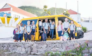 Sacred Heart School pupils getting off the bus at the start of the new school year.