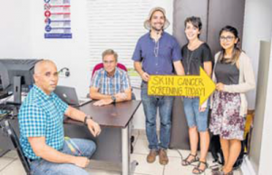 From left: skin cancer screening participant Ginno Romero, Dermatologist Dr. Johannes Van Duren, intern Carlos Quijada, volunteer health advocate Jackie Daley and Med School student Mehwish Siddiqui.