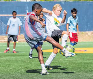 Battle for the ball during the Saba Day Soccer Tournament.