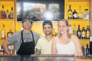 From left: The Hideaway’s Chef Ryan Jacobs with proprietors Camilo Usuga and Courtney Hassell.