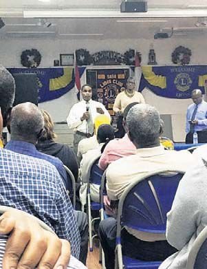 Managing Director Derrick Downes (standing at centre) speaking during the second town hall meeting on the closure of the Saba branch of Windward Islands Bank. (Caribbean Network-Hazel Durand photo)